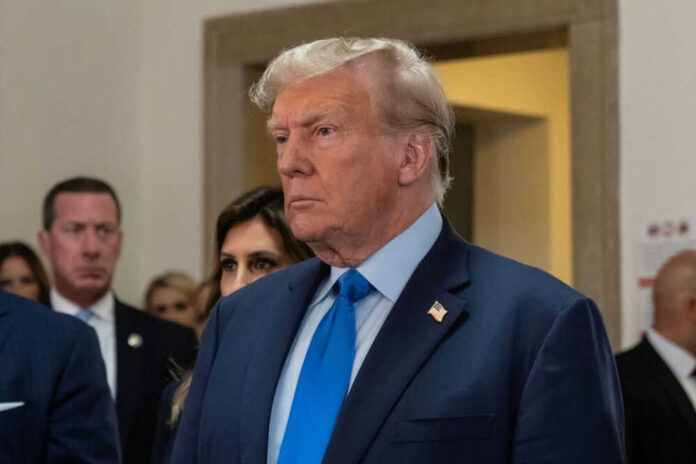 2369816069 Man in blue suit with serious expression indoors