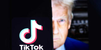 TikTok logo on screen with mans face behind
