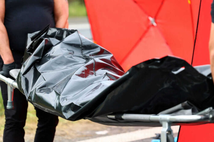 Navy Speedboat Crashes into Ferry, Leaving 13 Dead Person carrying body bag on stretcher outdoors