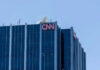 Glass building with CNN logo on rooftop